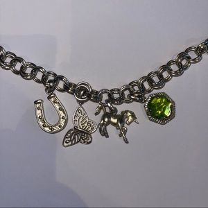 Kendra Scott gold charm bracelet with four charms